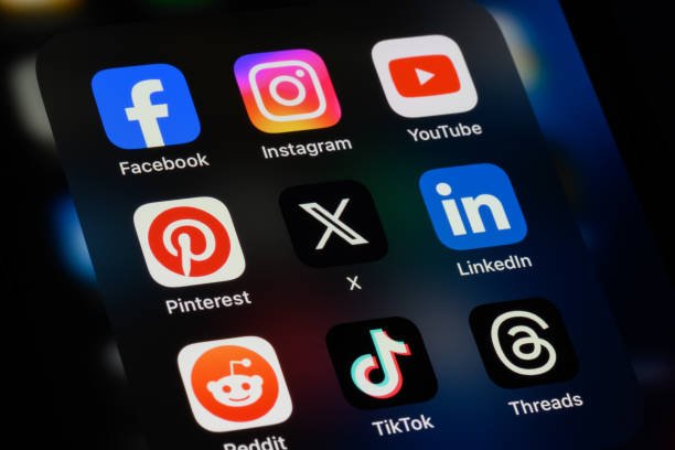 Toronto, Canada - September 24, 2023:  Popular social media apps on an Apple iPhone: Facebook, Instagram, YouTube, Pinterest, X (formerly Twitter), LinkedIn, Reddit, TikTok, and Threads.